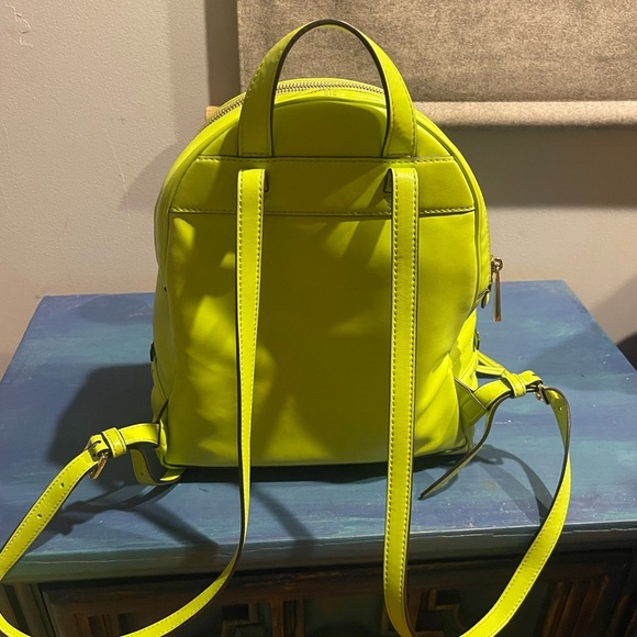 Gently used in excellent condition Michael Kors neon green back pack purse. - Picture 3 of 8